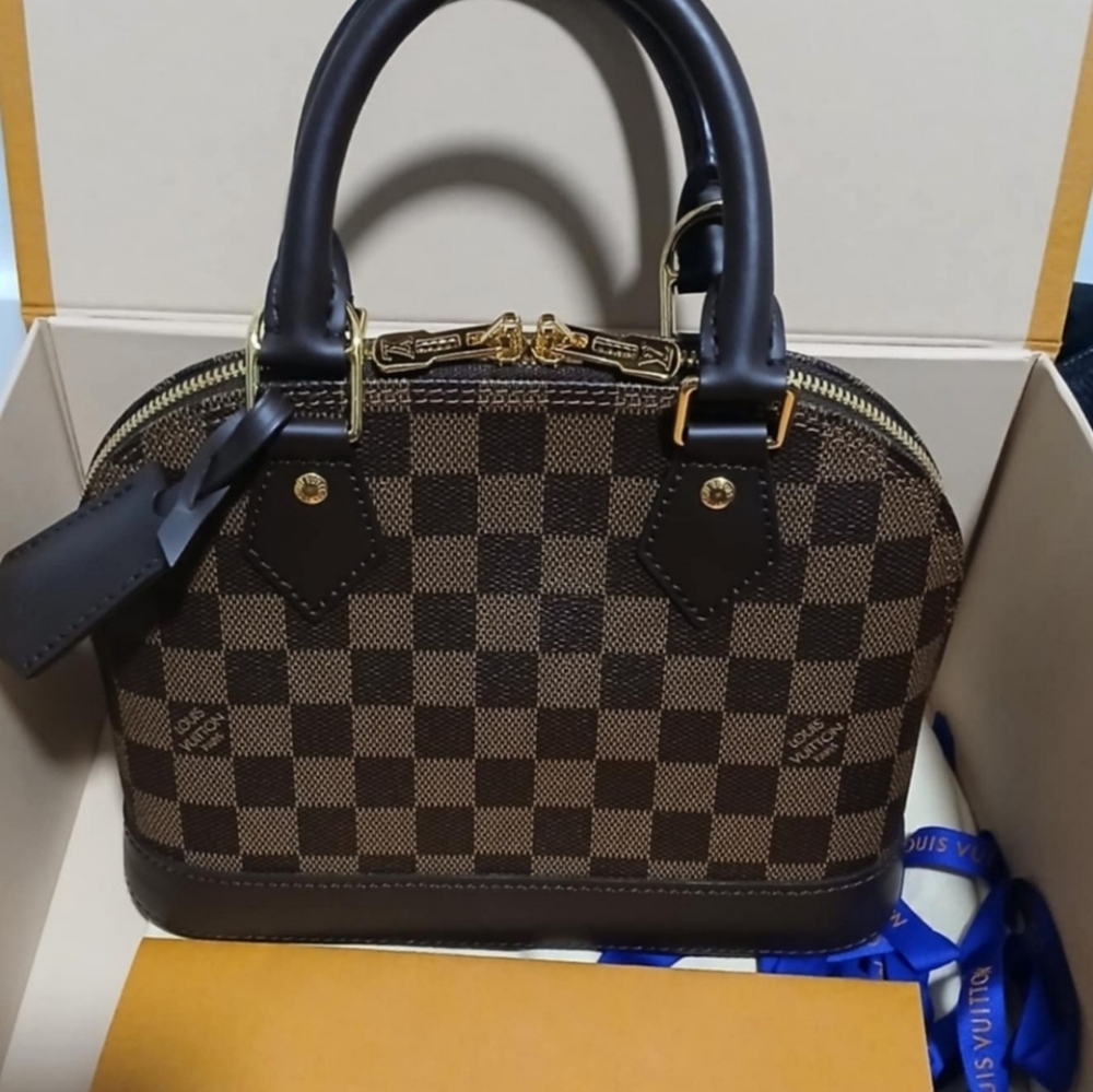 Louis Vuitton Brown Mini Bag with Structured Dome Shape